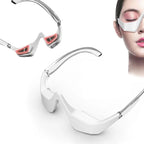 Woman using 3D red light EMS eye massager glasses for dark circles and eye fatigue relief with close-up view of wearable device