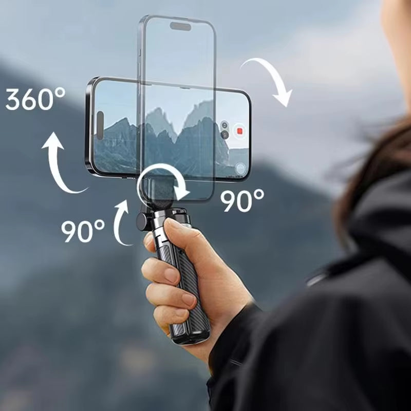 Handheld gimbal with smartphone mount—demonstrates 360° horizontal and 90° vertical rotation for dynamic photo and video capture in scenic mountain setting