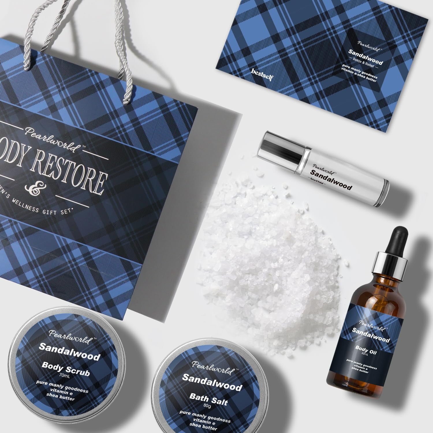 PEARLWORLD BODY RESTORE sandalwood wellness gift set—includes body scrub, bath salt, body oil, spray, and gift card in blue plaid packaging for relaxation and self-care