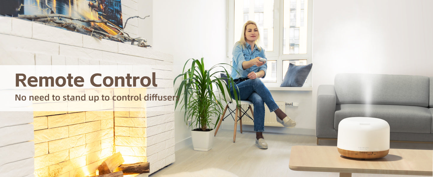 ASAKUKI diffuser with remote control in cozy living room—mist flowing beside fireplace for effortless aromatherapy and relaxation