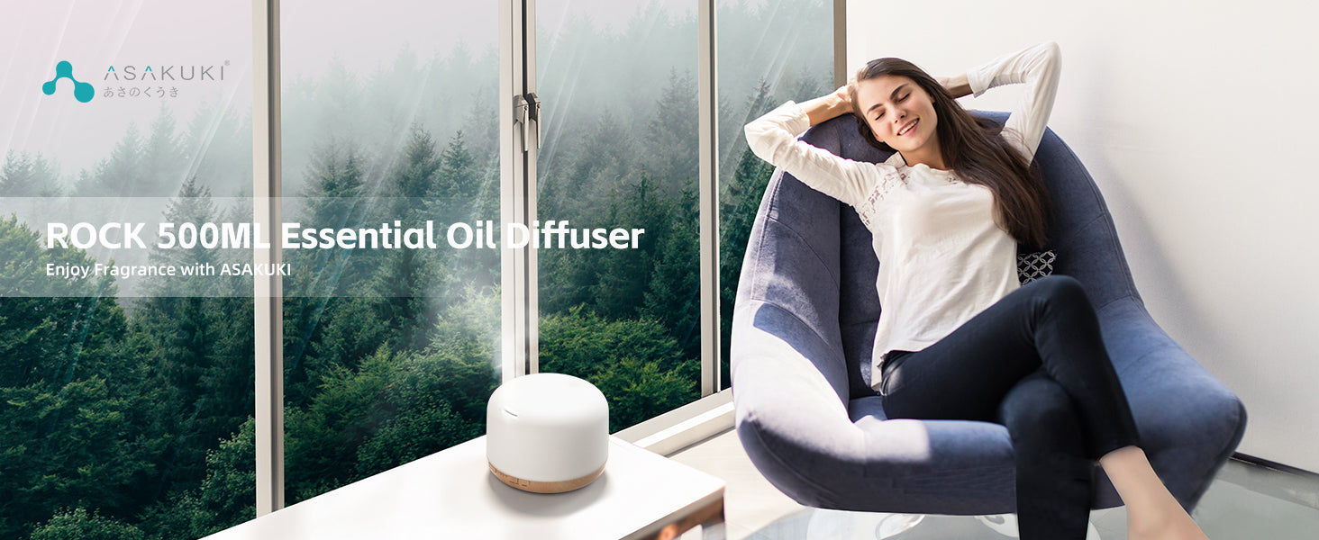 ASAKUKI ROCK 500ml essential oil diffuser in serene forest-view setting—promotes relaxation and wellness through ultrasonic aromatherapy