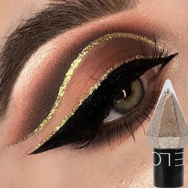 Close-up of bold black winged eyeliner with shimmering gold crease accent and ELO makeup product
