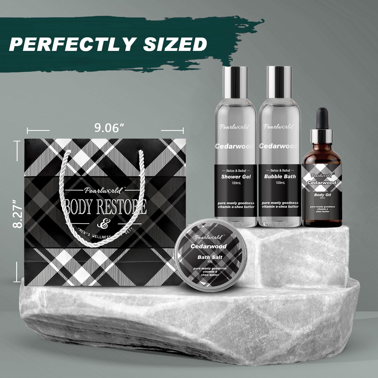 Body Restore cedarwood gift set—includes shower gel, bubble bath, body oil, bath salts, and plaid gift bag displayed on marble platform with size dimensions