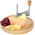 Stainless steel cheese curler with beechwood base shaving cheese ribbons, served with grapes