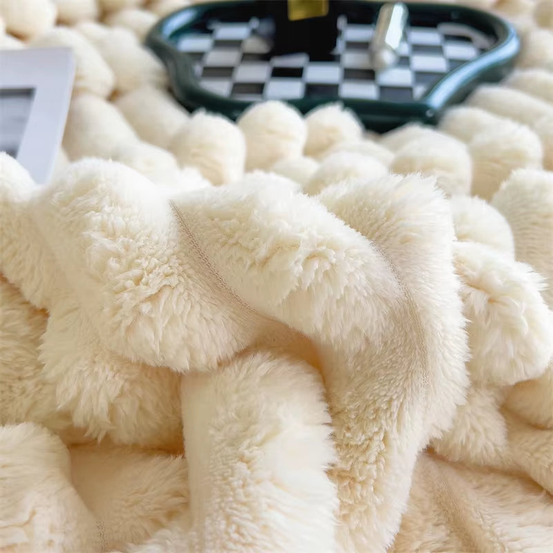 Close-up of cream-colored ribbed plush blanket with soft folds—luxurious texture and cozy ambiance featuring checkered tray and natural light
