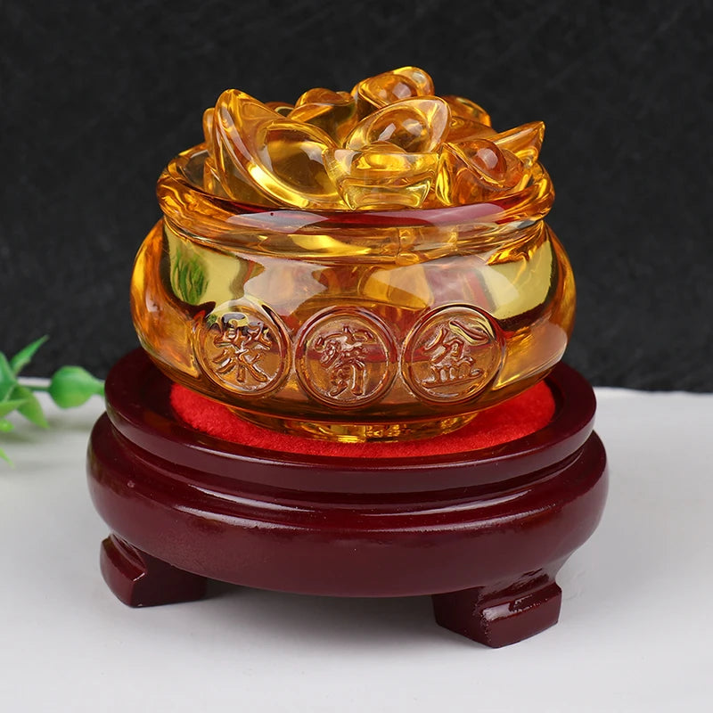 Feng Shui golden treasure bowl filled with crystal gold ingots on red and wooden stand symbolizing wealth, fortune, and abundance