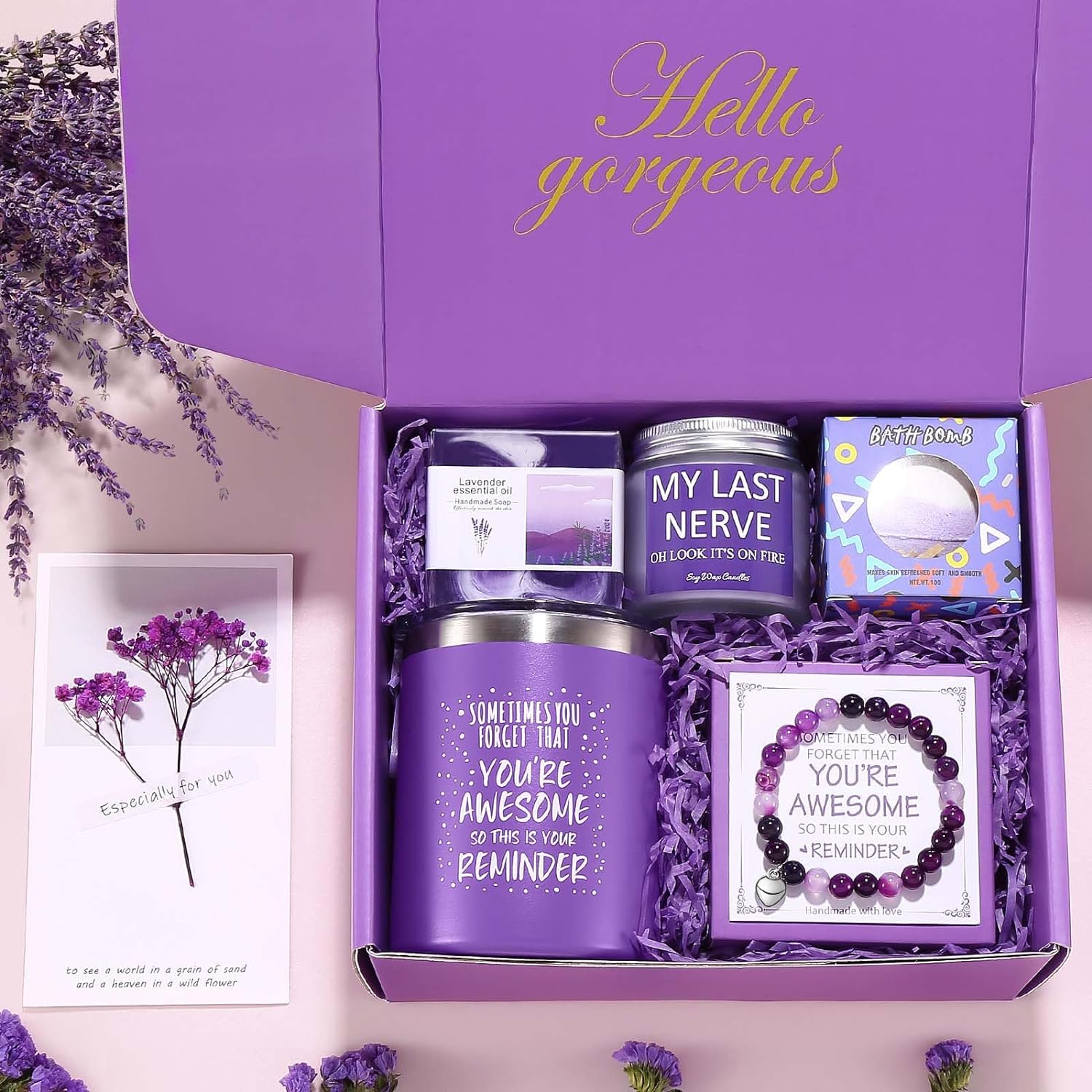 Purple spa gift box with motivational candle, bracelet, bath bomb, and dried flower card—arranged in shredded paper with “Hello Gorgeous” lid, perfect for birthdays, encouragement, and self-care gifting