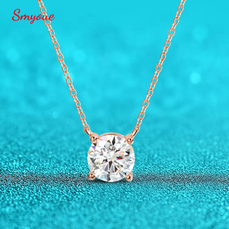 Smyoue rose gold necklace with round-cut moissanite pendant—set in 925 sterling silver against turquoise background for elegant gift appeal