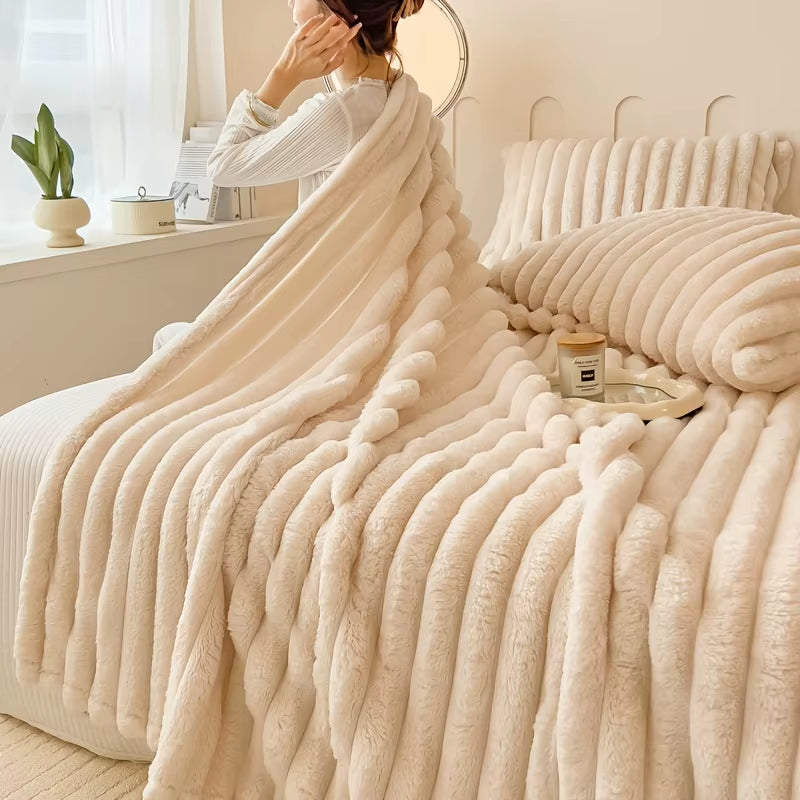 Cream-colored ribbed plush blanket and pillow set on a cozy bed—featuring a tea tray, bolster pillow, and soft natural light for a serene bedroom ambiance
